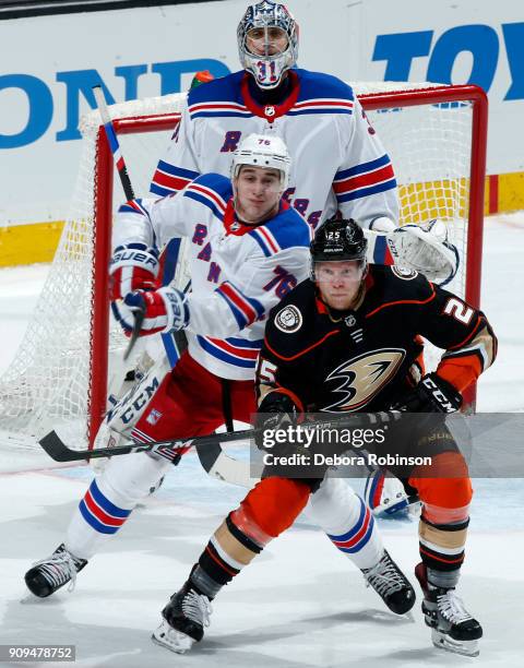 Ondrej Kase of the Anaheim Ducks battles in front of the net against Brady Skjei and Ondrej Pavelec of the New York Rangers during the game on...