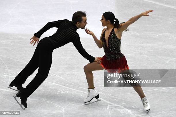 Kaitlin Hawayek and Jean-Luc Baker of the US perform at the ice dance - short dance competition at the ISU Four Continents Figure Skating...