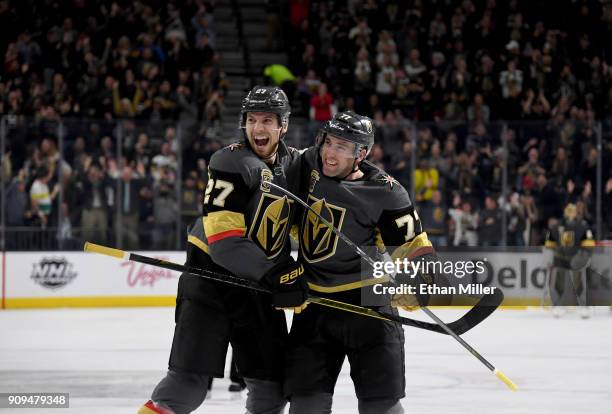Shea Theodore and Brad Hunt of the Vegas Golden Knights celebrate after Hunt scored a second-period goal against the Columbus Blue Jackets during...