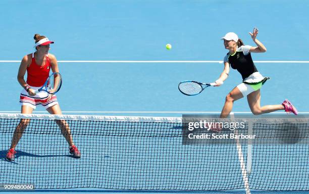 Irina-Camelia Begu of Romania and Monica Niculescu of Romania compete in their women's doubles semi-final match against Ekaterina Makarova of Russia...