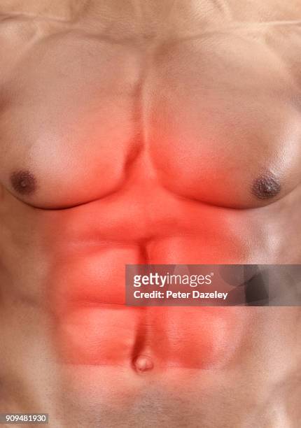 stomach ache indigestion strained muscles - black male bodybuilders foto e immagini stock