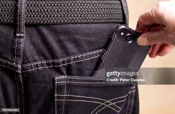 stealing smart phone from jeans pocket - robbery stock-fotos und bilder