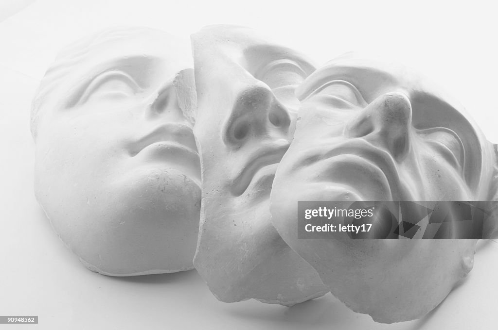 Three white gypsum faces