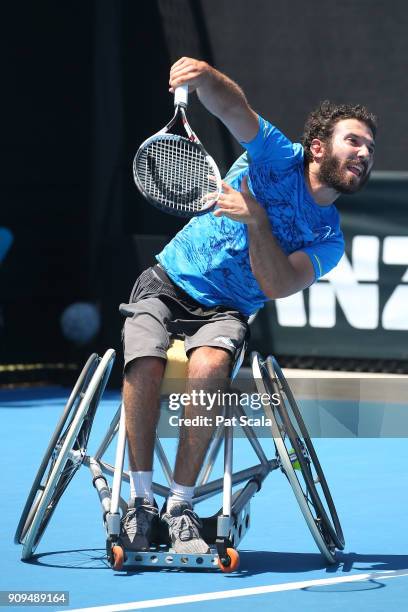 Adam Kellerman of Australia serves in his first round match against Stephane Houdet of France in the Australian Open 2018 Wheelchair Championships at...