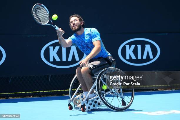 Adam Kellerman of Australia plays a forehand in his first round match against Stephane Houdet of France in the Australian Open 2018 Wheelchair...
