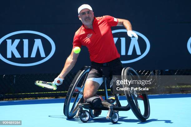 Stephane Houdet of France plays a backhand in his first round match against Adam Kellerman of Australia in the Australian Open 2018 Wheelchair...