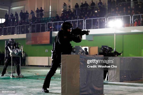 South Korean police SWAT team demonstrate the anti-terror operation at the starting ceremony of PyeongChang Olympic Security Force before the...