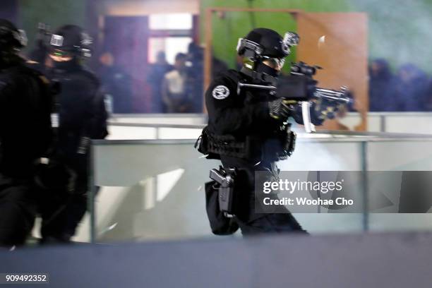 South Korean police SWAT team demonstrate the anti-terror operation at the starting ceremony of PyeongChang Olympic Security Force before the...