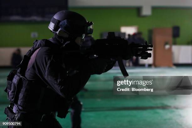 Member of the South Korean Special Weapons and Tactics team participates in a simulated terrorism crisis drill in advance of the 2018 PyeongChang...