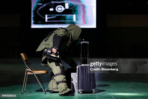 South Korean Explosive Ordnance Disposal technician inspects a suitcase during a simulated terrorism crisis drill in advance of the 2018 PyeongChang...