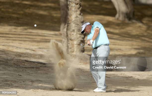 Colin Montgomerie of Scotland plays a shot during the pro-am as a preview for the Omega Dubai Desert Classic on the Majlis Cours at Emirates Golf...