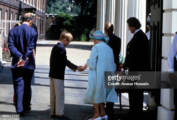 Prince Harry takes the hand of Queen Elizabeth, The Queen Mother outside Clarence House on her 95th Birthday on August 04, 1995 in London, England.