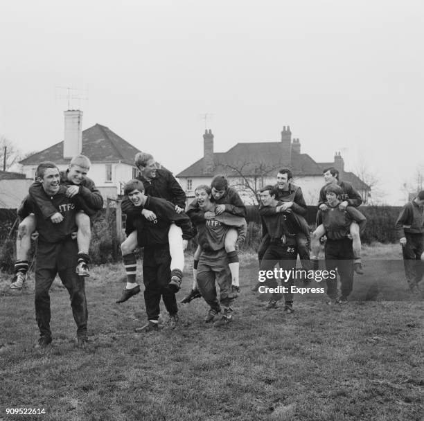 Northampton Town FC players carry each others piggyback during a training session, UK, 23rd December 1968.