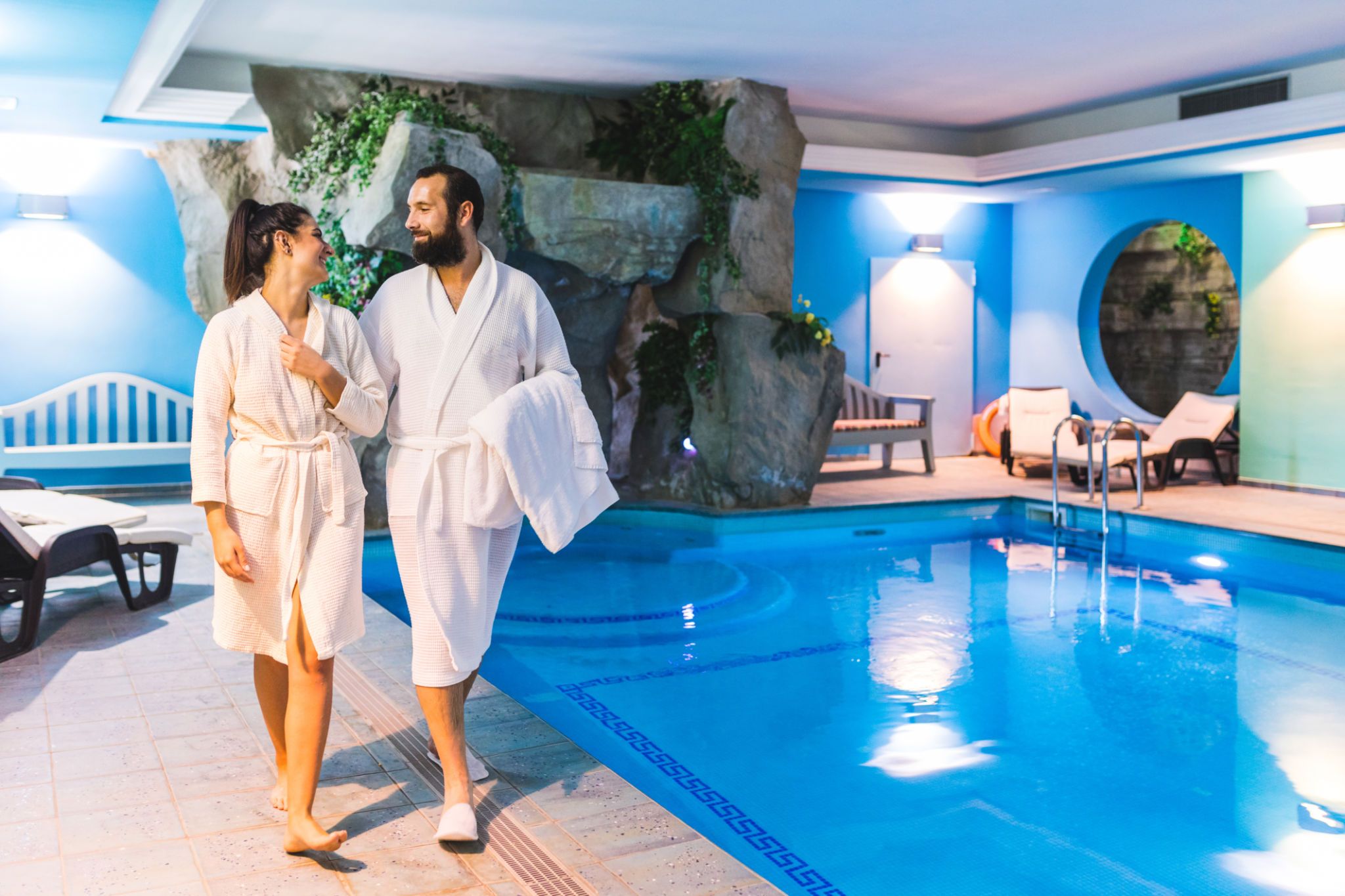 Couple in relax at therme, spa with swimming pool Couple in relax at therme, spa with swimming pool