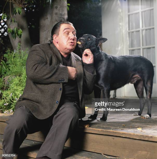 American actor Joe Viterelli with a friendly dog, circa 1995.