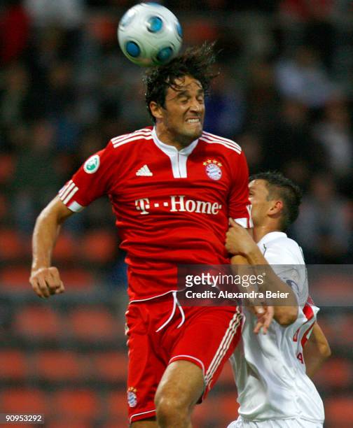 Luca Toni of Muenchen heads for the ball with Alexander Maul of Regensburg during the Third Liga match between Bayern Muenchen II and SSV Jahn...