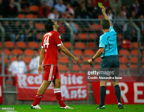 Luca Toni of Muenchen receives a yellow card by referee Dominik Nowak during the Third Liga match between Bayern Muenchen II and SSV Jahn Regensburg...