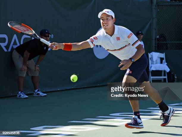 Kei Nishikori reaches for the ball during his loss to Dennis Novikov in Newport Beach, California, on Jan. 23 on the ATP Challenger Tour. ==Kyodo