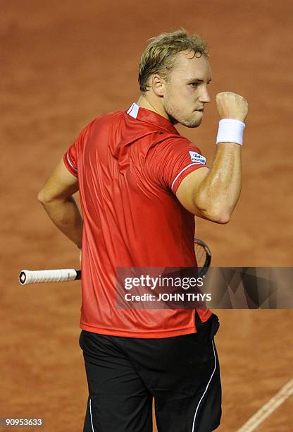 Steve Darcis of Belgium celebrates after winning against Ukrainian Sergiy Stakhovsky during their Davis Cup World group play-off tennis match in...