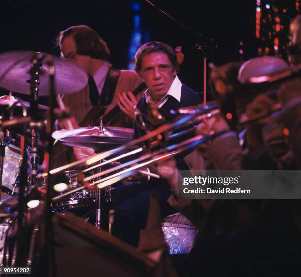 American jazz drummer Buddy Rich performs live on stage playing his drum kit with members of the Buddy Rich Orchestra circa 1978.