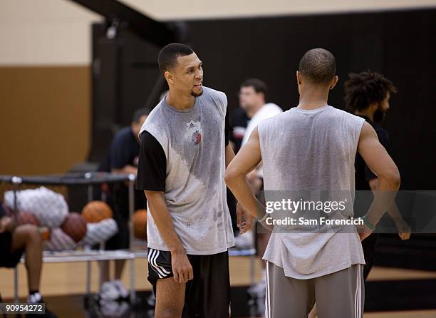 Brandon Roy of the Portland Trail Blazers chats with Trail Blazer team mate Jerryd Bayless his daily workout at the Trail Blazer Practice Facility in...