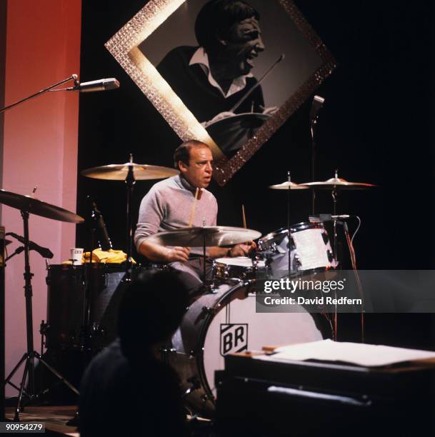 American jazz drummer Buddy Rich performs live on stage playing a Ludwig drum kit during the recording of a television show at BBC Television Centre...