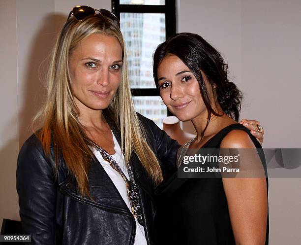 Actresses Molly Sims and Emmanuelle Chriqui attend the Victoria's Secret Fashion Week Suite at Bryant Park Hotel on September 16, 2009 in New York...
