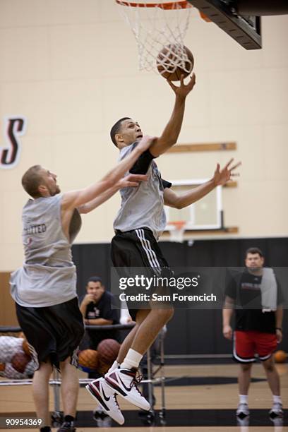 Brandon Roy of the Portland Trail Blazers goes to the hoop against Trail Blazer team mate Steve Blake during his daily workout at the Trail Blazer...