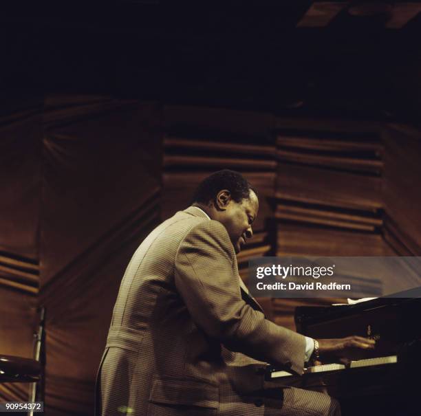 Pianist Oscar Peterson performs on stage at Ronnie Scott's in London, England in 1974.