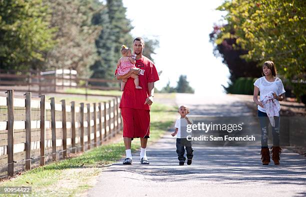 Brandon Roy of the Portland Trail Blazers walks with his family near Roy's home in Tualatin, Oregon September 17, 2009. From left to right are Mariah...