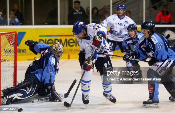 Scott King of Mannheim gets in a fight with Straubing's goalie Mike Bales and his team mate Eric Meloche during the DEL match between Straubing...