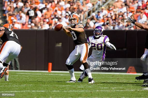 Brady Quinn of the Cleveland Browns passes against Madieu Williams of the Minnesota Vikings on September 13, 2009 at Cleveland Browns Stadium in...