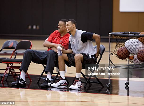Brandon Roy of the Portland Trail Blazers shares a moment with Trail Blazer assistant coach Maurice Lucas during Roy's daily workout at the Trail...