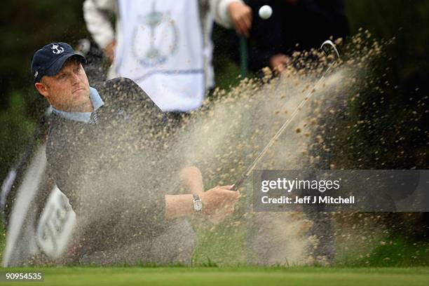 Eric Lippert of USA plays out the bunker on the 13th green in the afternoon four ball matches at The Carrick on Loch Lomond on September 18, 2009 in...