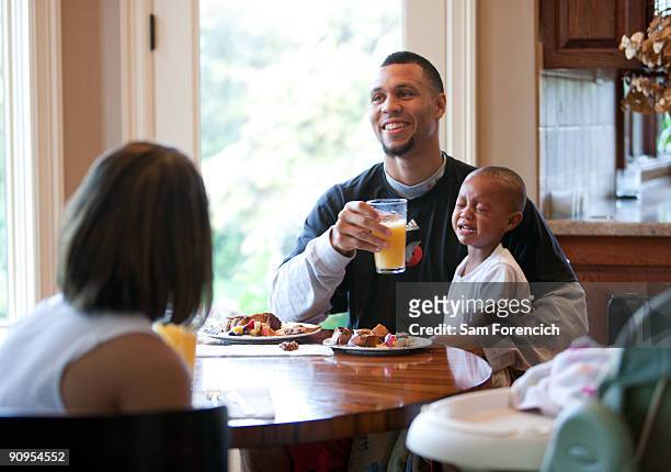Brandon Roy of the Portland Trail Blazers eats breakfast with his fiancee Tiana and son Brandon Jr. At Roy's home in Tualatin, Oregon September 17,...
