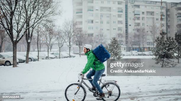 delivery boy on a bike - take away food courier stock pictures, royalty-free photos & images