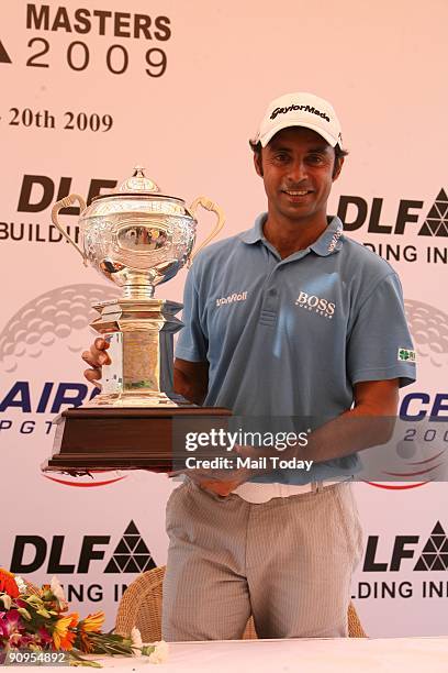 Golfer Jyoti Randhawa unveils the 2009 DLF Masters trophy at the DLF Golf and Country Club in Gurgaon on Tuesday, September 16, 2009.