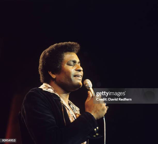 Singer Charley Pride performs on stage in the 1970's.