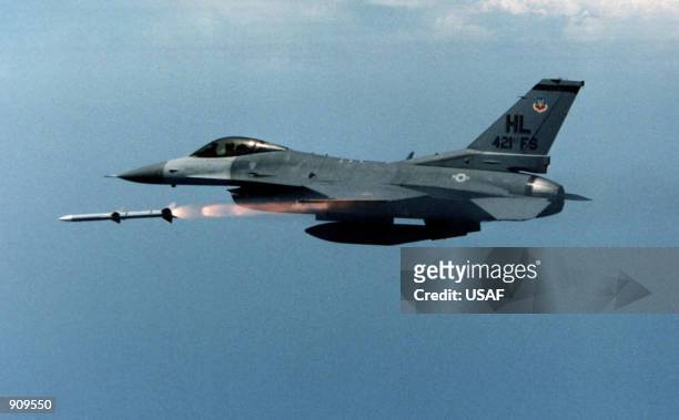 An F-16 from 421st Fighter Squadron, Hill Air Force Base, Utah releases the first AIM-120 Advanced Medium Range Air-to-Air Missile over reservation...
