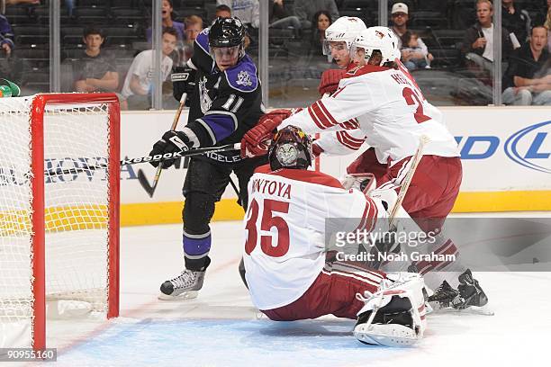 Anze Kopitar of the Los Angeles Kings shoots against Al Montoya and Shaun Heshka of the Phoenix Coyotes on September 15, 2009 at Staples Center in...