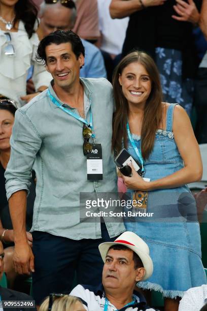 Radio personality Andy Lee and his partner Rebecca Harding watch the quarter-final between Roger Federer of Switzerland and Tomas Berdych of the...