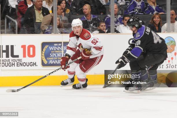 Chad Kolarik of the Phoenix Coyotes carries the puck against Andrew Loktionov of the Los Angeles Kings on September 15, 2009 at Staples Center in Los...