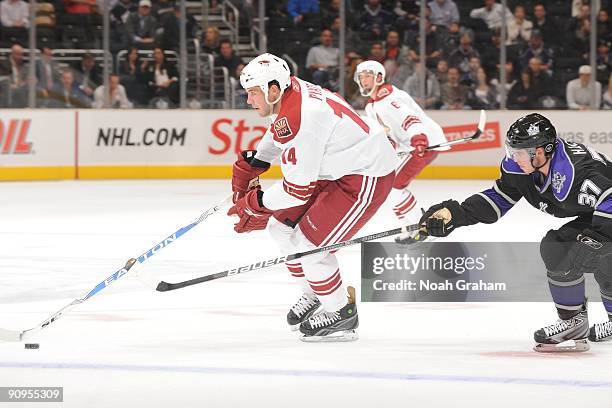 Taylor Pyatt of the Phoenix Coyotes carries the puck against Thomas Hickey of the Los Angeles Kings on September 15, 2009 at Staples Center in Los...