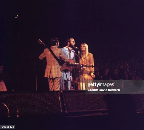 Peter Yarrow, Noel 'Paul' Stookey and Mary Travers of Peter, Paul and Mary perform on stage in the 1970's.