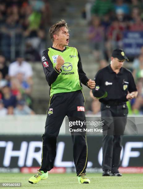Chris Green of the Thunder celebrates taking the wicket of Marcus Harris of the Renegades during the Big Bash League match between the Sydney Thunder...