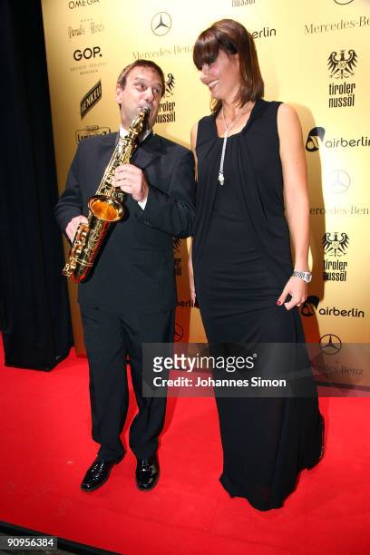 Franziska van Almsick and musician Dimitri of Hot Saxx attend the United People Charity Night on September 18, 2009 in Munich, Germany.