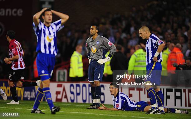 Goalkeeper Lee Grant of Sheffield Wednesday looks dejected along with his team mates after conceeding an own goal during the Coca-Cola Championship...