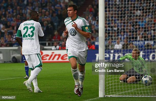 Edin Dzeko of Wolfsburg celebrates after scoring the opening goal of Wolfsburg during the Bundesliga match between FC Schalke 04 and VfL Wolfsburg at...