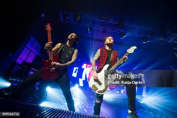 Denis Stoff and Ben Bruce of Asking Alexandria perform live on stage at O2 Academy Birmingham on January 23, 2018 in Birmingham, England.