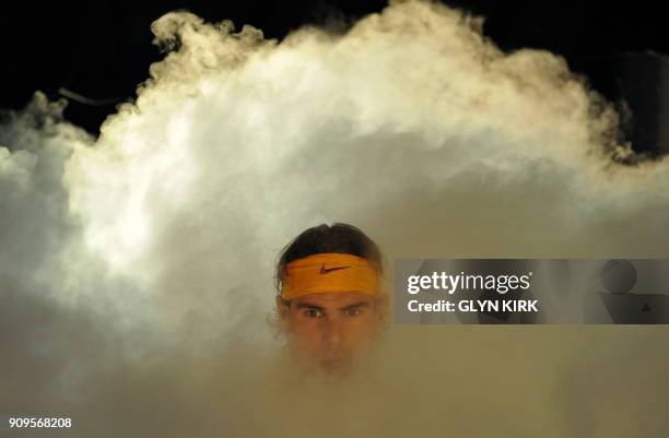 Spain's Rafael Nadal arrives on court to play Czech Republic player Tomas Berdych , during their singles tennis match, on the sixth day of the ATP...